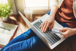 Woman,Is,Holding,Credit,Card,And,Using,Laptop,Computer.,Online